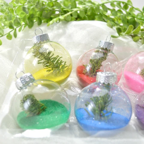 selection of colored sand ornaments with decorations